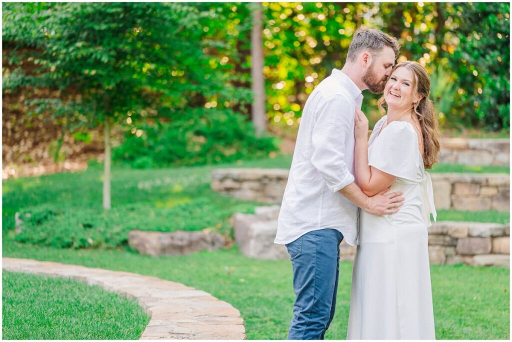 Sweet nuzzles and kisses during a happy couples Duke Gardens engagement photos by JoLynn Photography