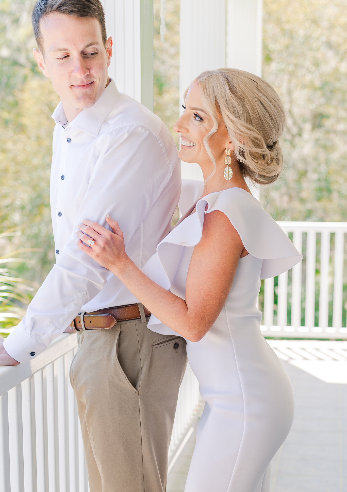 A stunning couple at an elegant estate for their Raleigh engagement photography session by JoLynn Photography