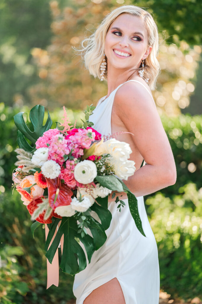 A happy blonde bride enjoying her bridal portrait session by JoLynn Photography