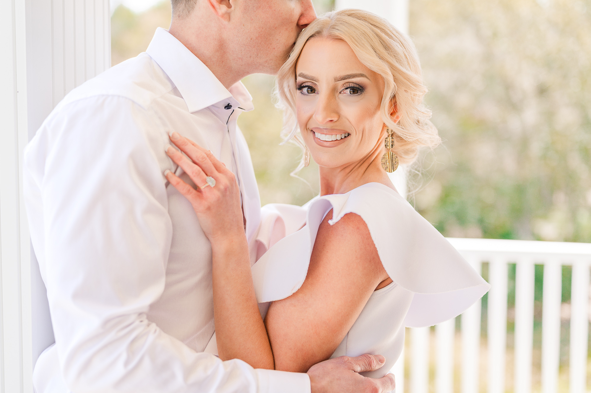 A happy couple during their engagement session that invested in Raleigh wedding spray tanning before their session