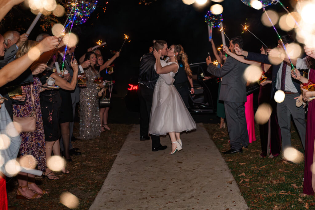 A bride and groom having a grand sparkler exit at the Hudson Manor