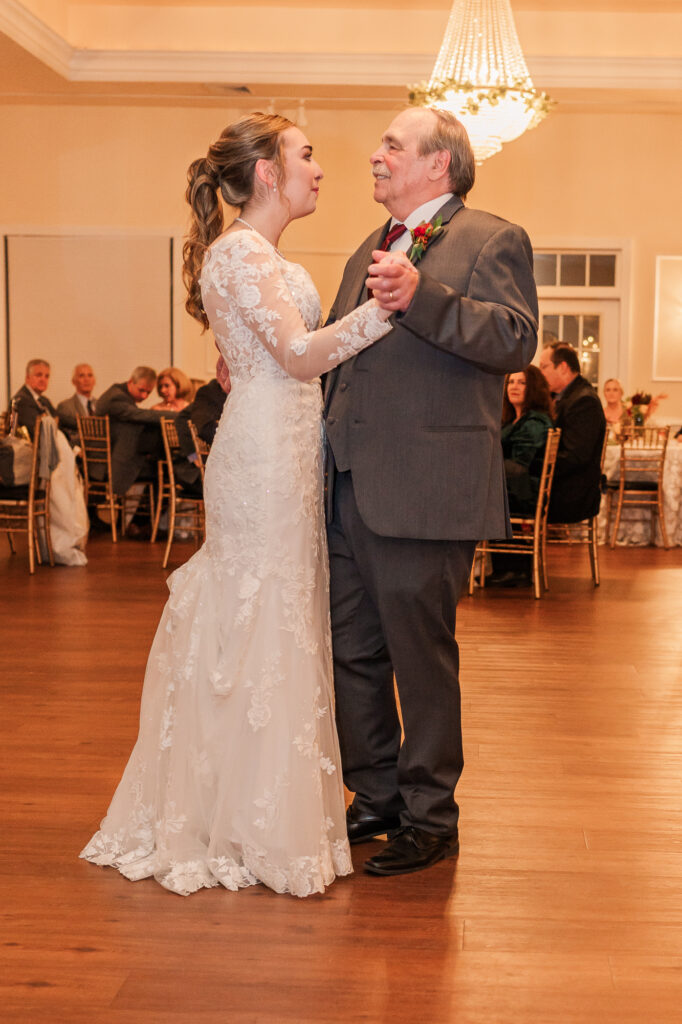 A father and daughter having a dance at her wedding at the Hudson Manor