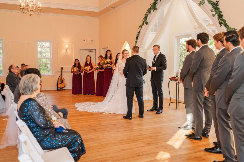 A bride and groom getting married at the Hudson Manor