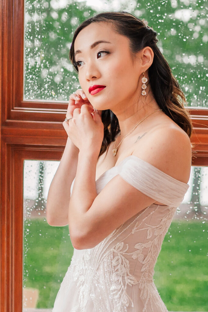 A stunning Asian bride at a waterfront Wilmington wedding venue by JoLynn Photography