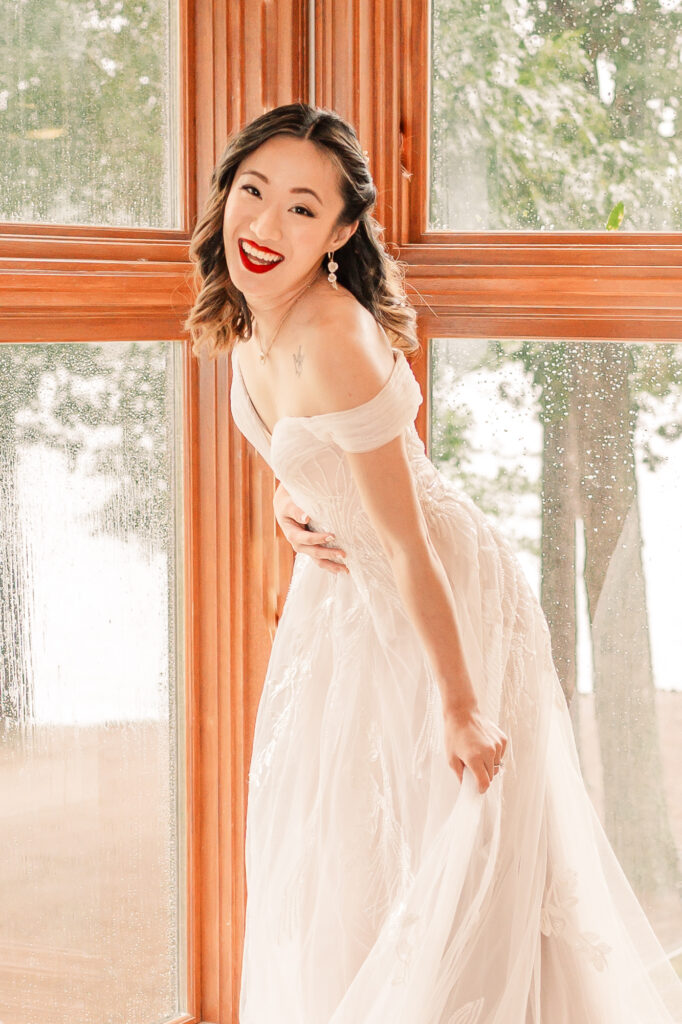 A happy Asian bride during her bridal portrait session by JoLynn Photography