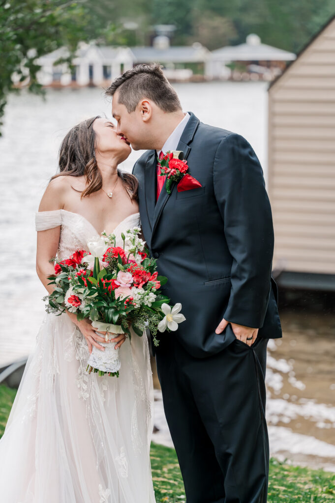 A happy newly wed couple kissing at their Lake Gaston Wedding by JoLynn Photography