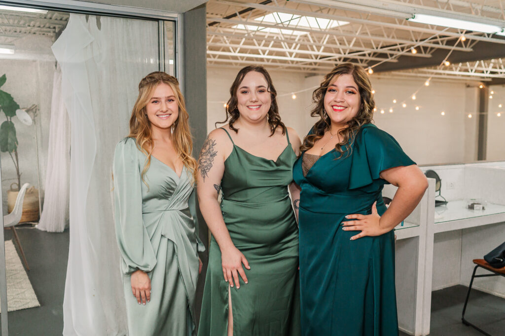Happy bridesmaids in beautiful green dresses at The Atrium Wedding Venue