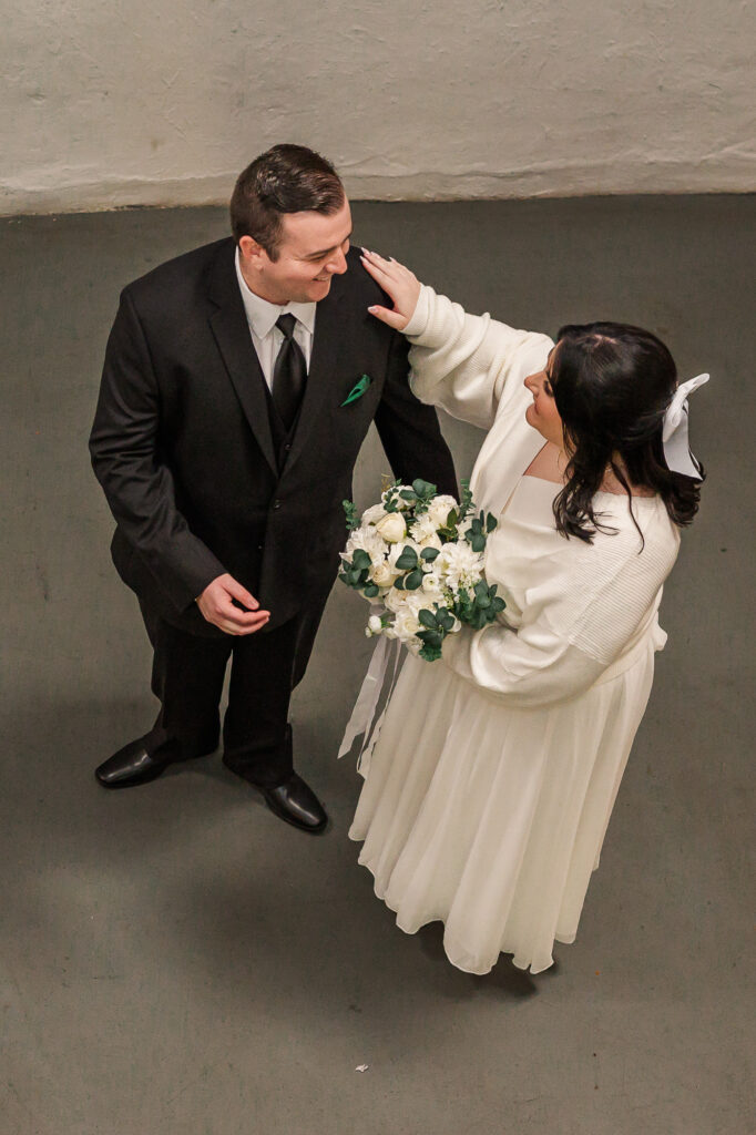 A bride and groom having a first look at The Atrium Wedding Venue by JoLynn Photography