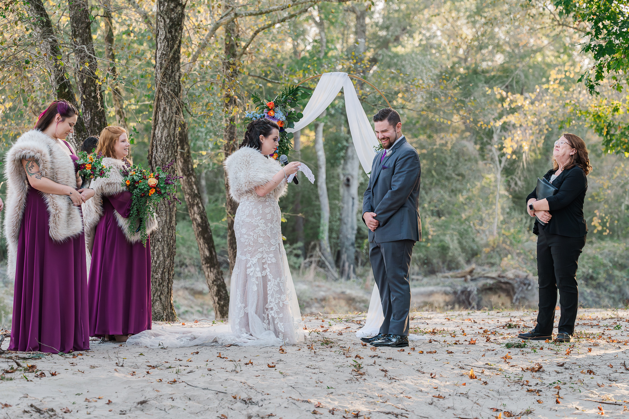 A couple exchanging their vows at The River Landing Wedding Venue