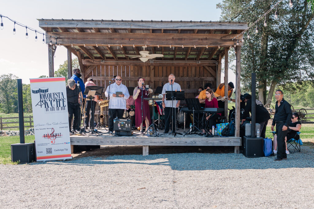 A live Spanish band at a wedding reception at Boots and Roots Farm by JoLynn Photography