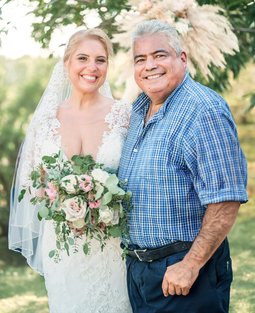 A bride with her dad at Boots and Roots Farm on her wedding day by JoLynn Photography
