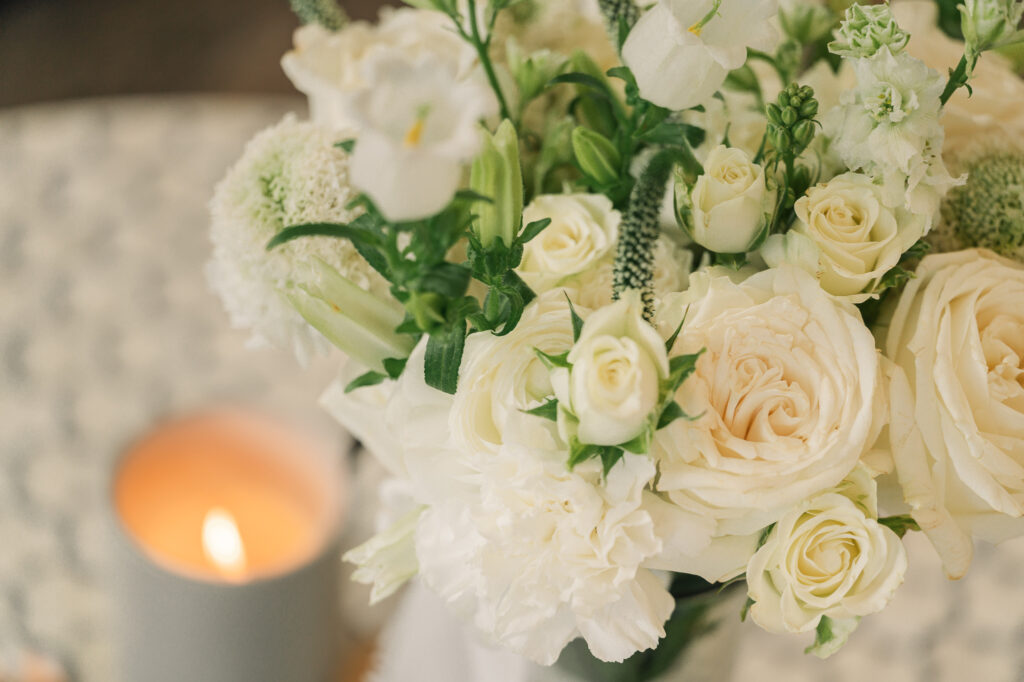 A bridal bouquet and a candle