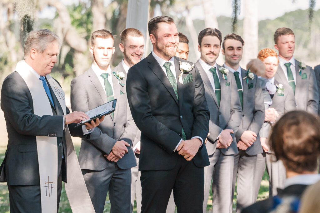A groom seeing his soon to be wife walking down the aisle at a Savannah Destination Wedding