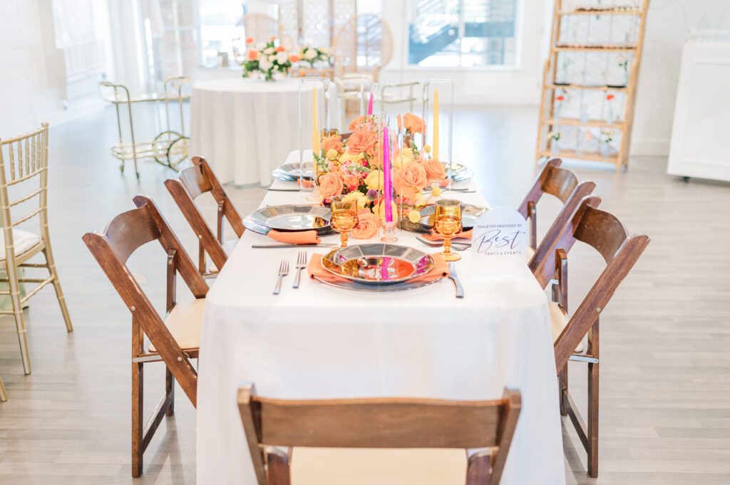 A beautiful warm tablescape at an Apex wedding venue designed by a wedding planner