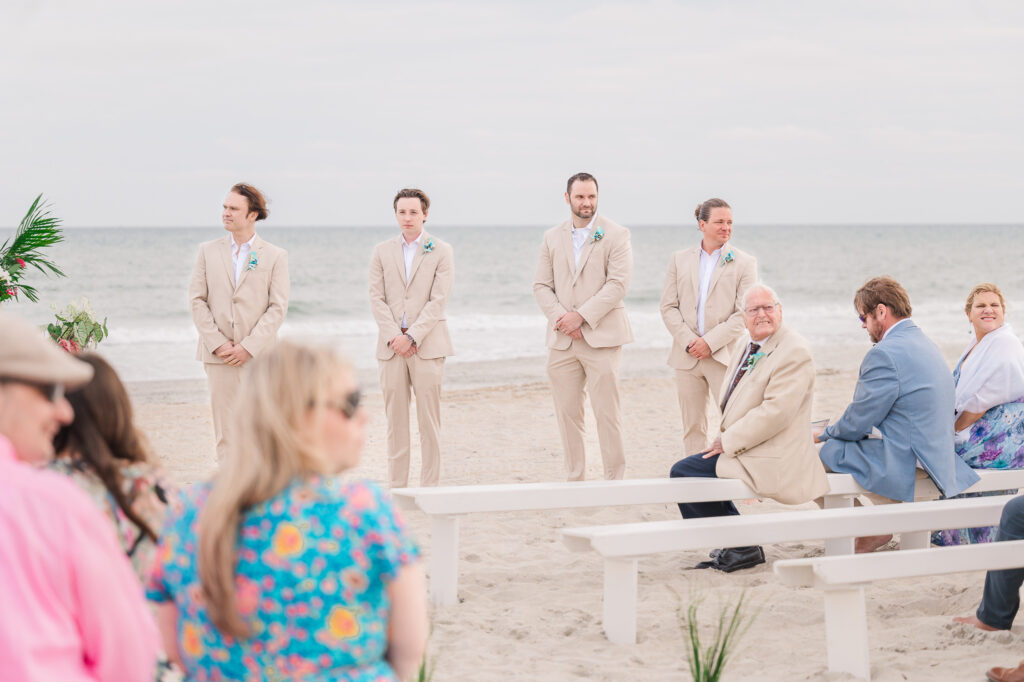 Groomsmen during a North Carolina beachside wedding ceremony
