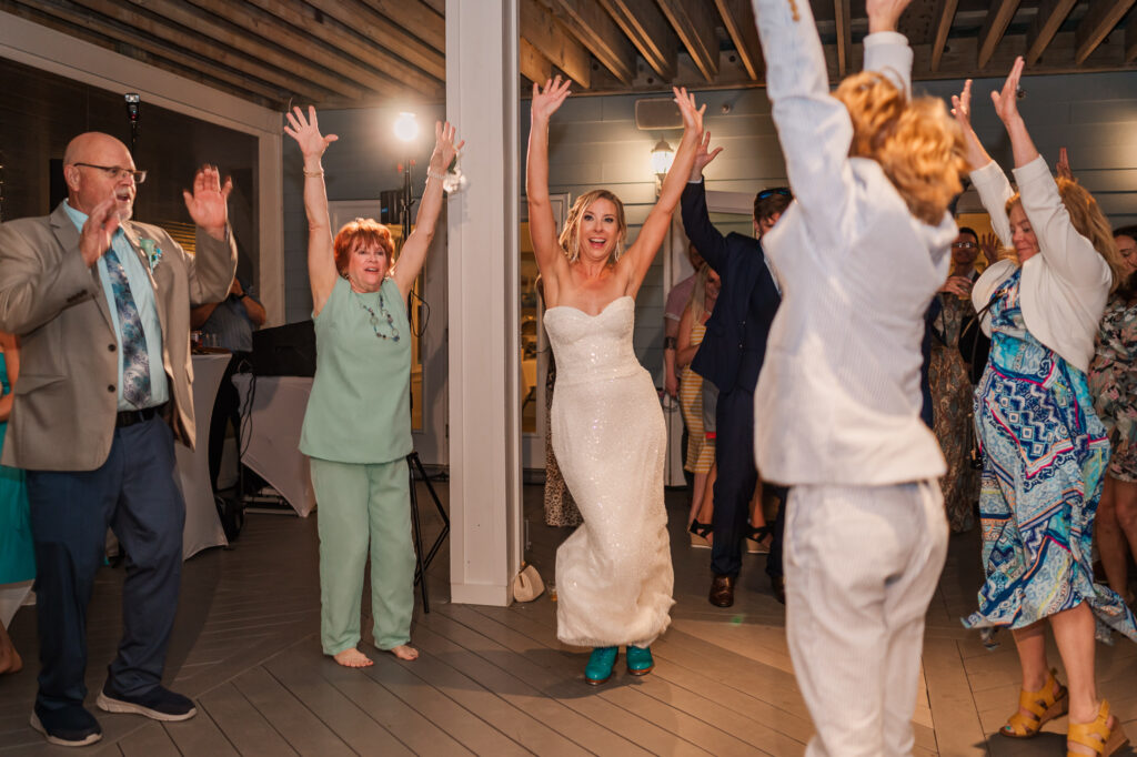 A bride dancing with her family at The Cottage