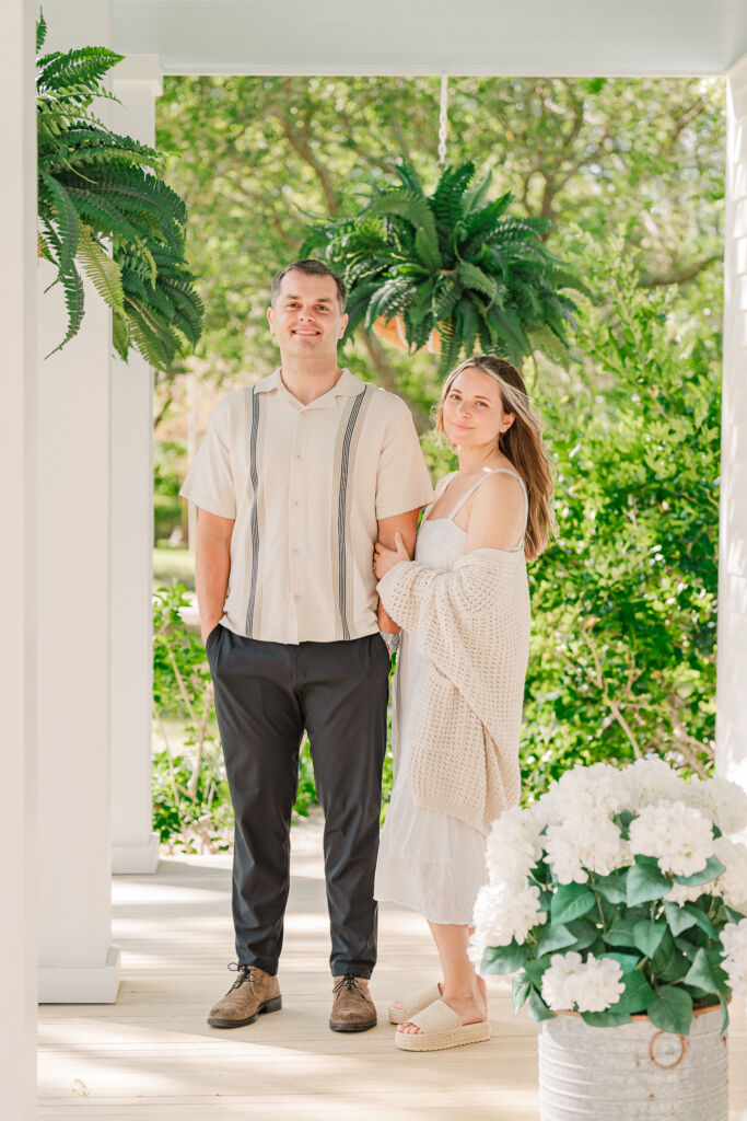 A happy young couple enjoying their Sycamore Bend engagement during the spring by JoLynn Photography