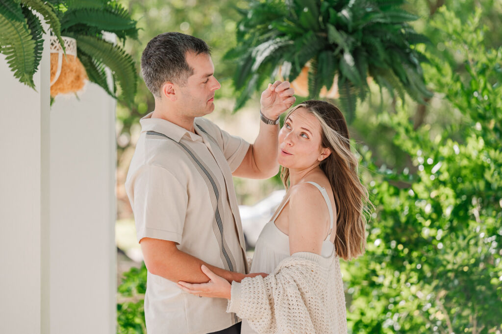 A couple playing during their Sycamore Bend engagement by JoLynn Photography