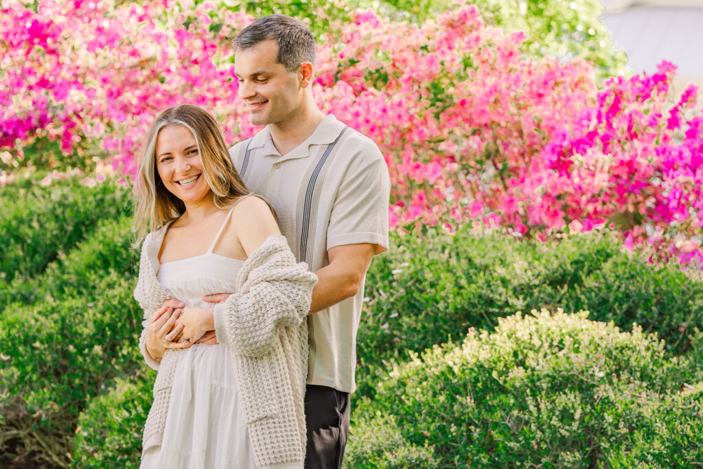 Hugs and laughter by a newly engaged couple during their Sycamore Bend engagement session by JoLynn Photography