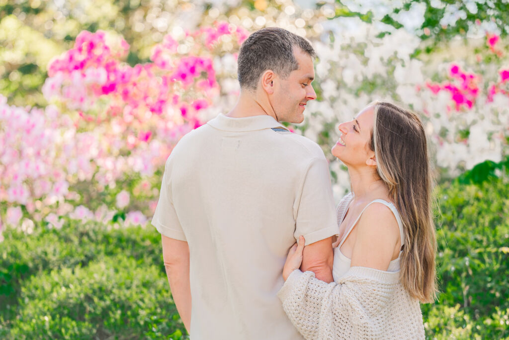 Glowing azaleas and smiles during a Sycamore Bend engagement session