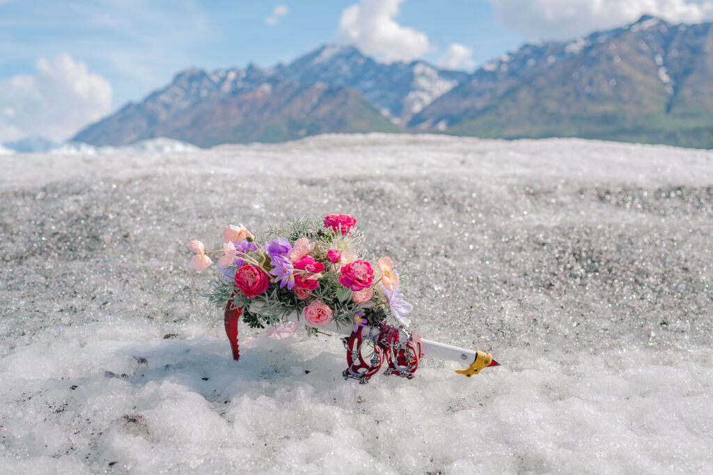 A couple enjoying their destination wedding on Matanuska Glacier for their Alaskan Glacier Wedding by destination wedding photographer, JoLynn Photography