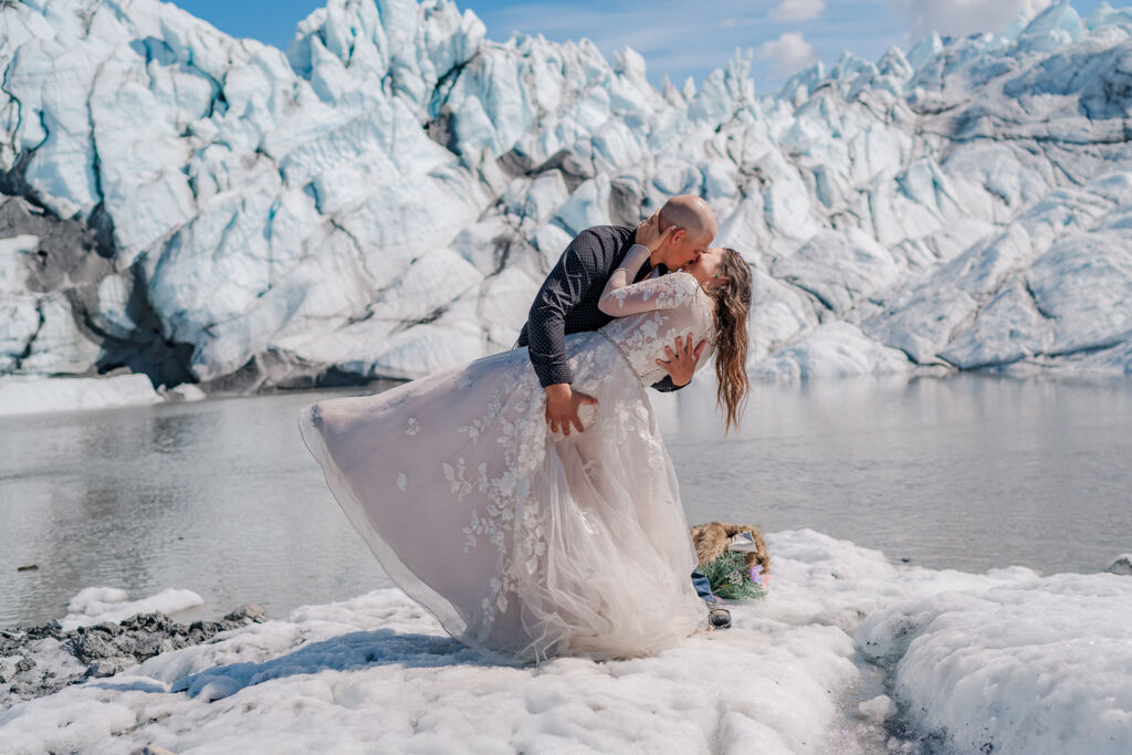 A couple enjoying their destination wedding on Matanuska Glacier for their Alaskan Glacier Wedding by destination wedding photographer, JoLynn Photography