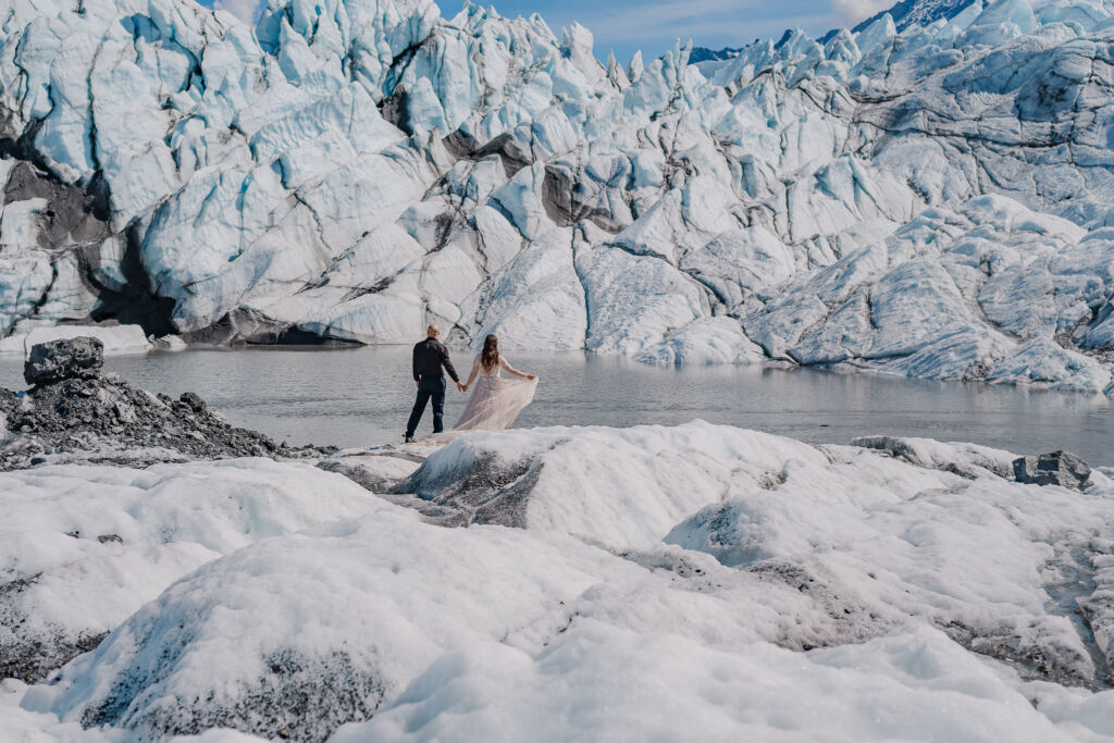 A couple enjoying their destination wedding on Matanuska Glacier for their Alaska Glacier Wedding by destination wedding photographer, JoLynn Photography
