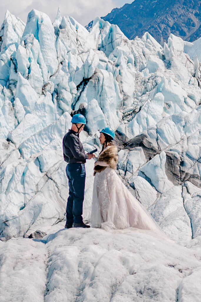 A couple enjoying their destination wedding on Matanuska Glacier for their Alaskan Glacier Wedding by destination wedding photographer, JoLynn Photography