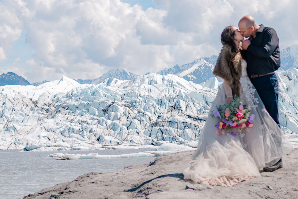 A couple enjoying their destination wedding on Matanuska Glacier for their Alaskan Glacier Wedding by destination wedding photographer, JoLynn Photography