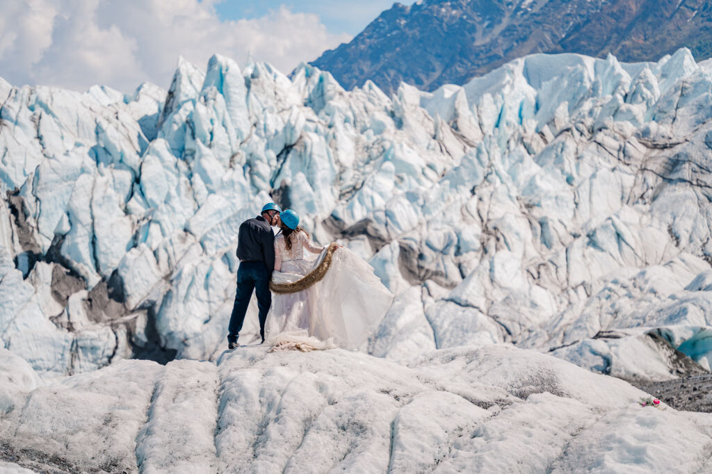 A couple enjoying their destination wedding on Matanuska Glacier for their Alaskan Glacier Wedding by destination wedding photographer, JoLynn Photography