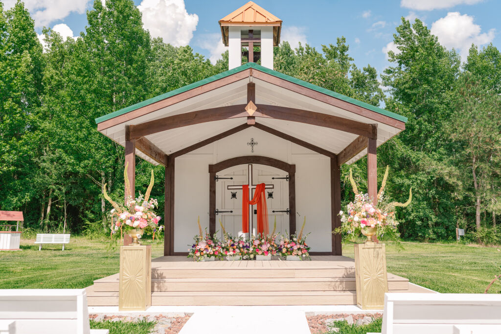 A three-tiered wedding ceremony outdoor space at The English Country Barn