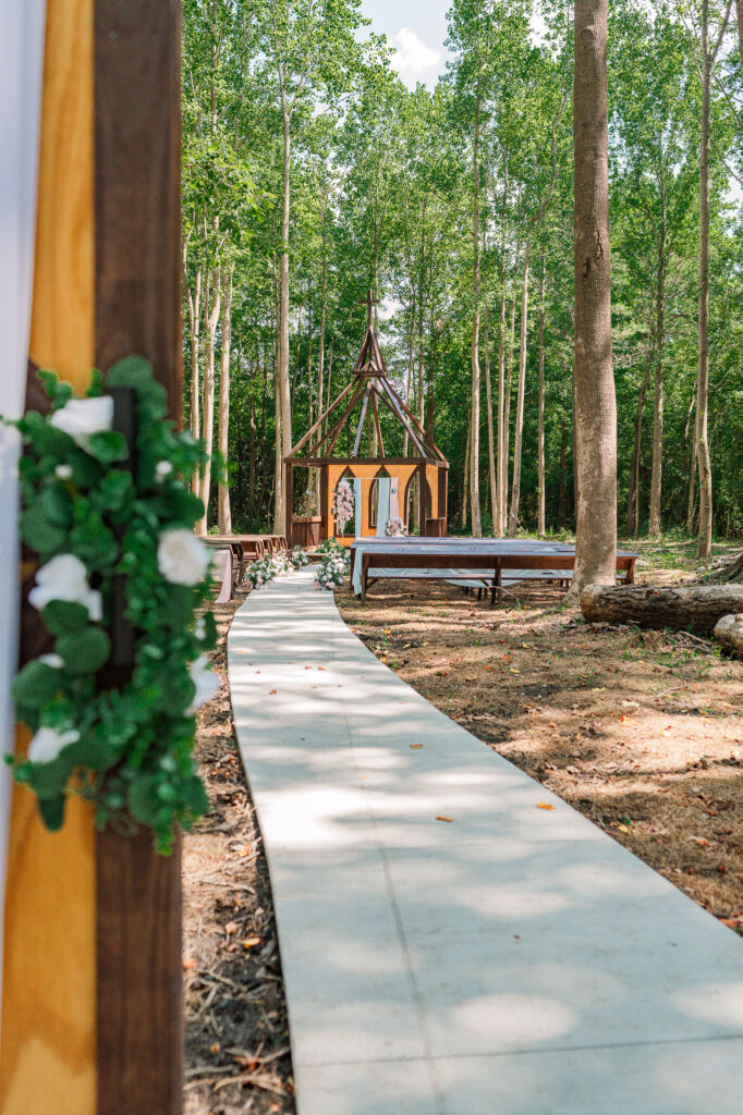 The enchanted gardens entrance at The English Country Barn by JoLynn Photography