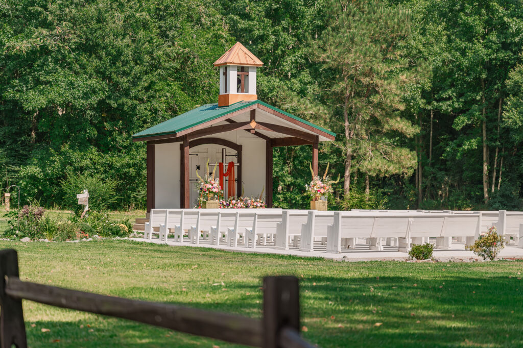 An outdoor wedding chapel on a summer afternoon from the cornfields at The English Country Barn by JoLynn Photography