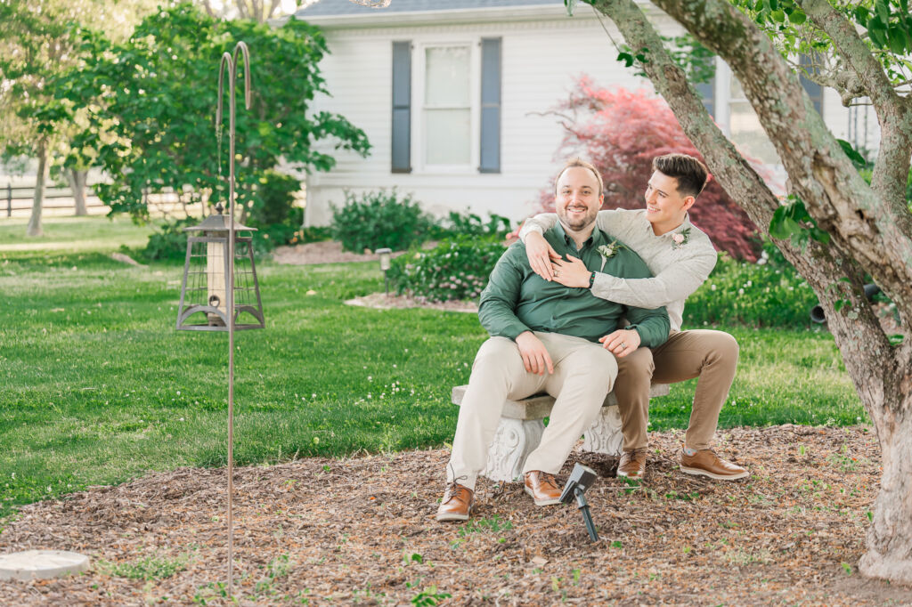 A loving same-sex couple at their intimate wedding at Highrock Farms in the summertime while enjoying their Oxford wedding photography by JoLynn Photography