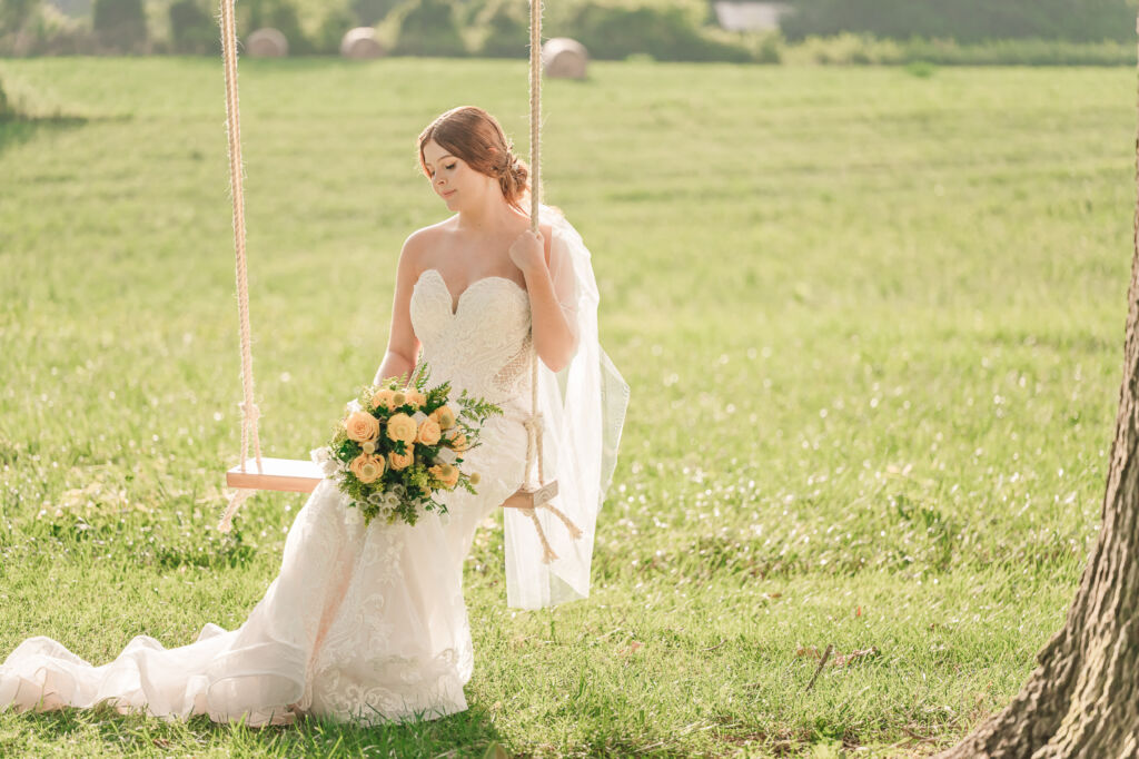 A loving couple enjoying their Winston-Salem wedding in the illuminating countryside at sunset