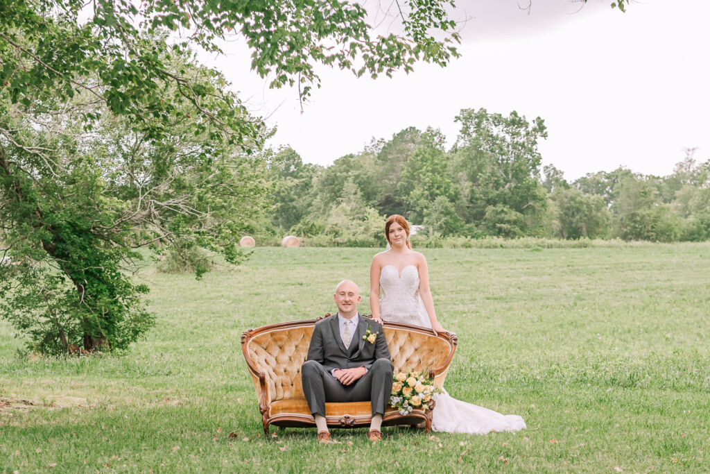 A loving couple enjoying their Winston-Salem wedding in the illuminating countryside at sunset