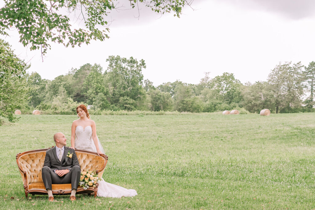 A loving couple enjoying their Winston-Salem wedding in the illuminating countryside at sunset