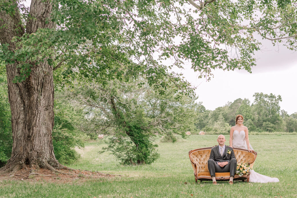 A loving couple enjoying their Winston-Salem wedding in the illuminating countryside at sunset