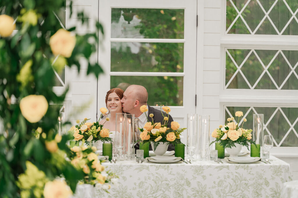 A loving couple enjoying their Winston-Salem wedding in the illuminating countryside at sunset