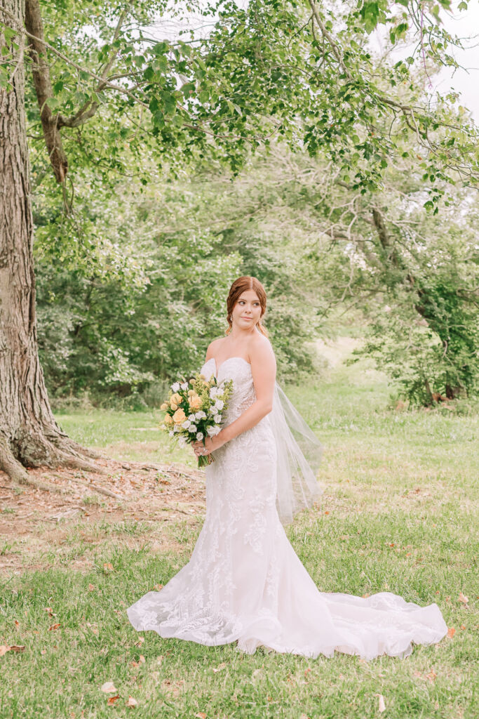 A loving couple enjoying their Winston-Salem wedding in the illuminating countryside at sunset