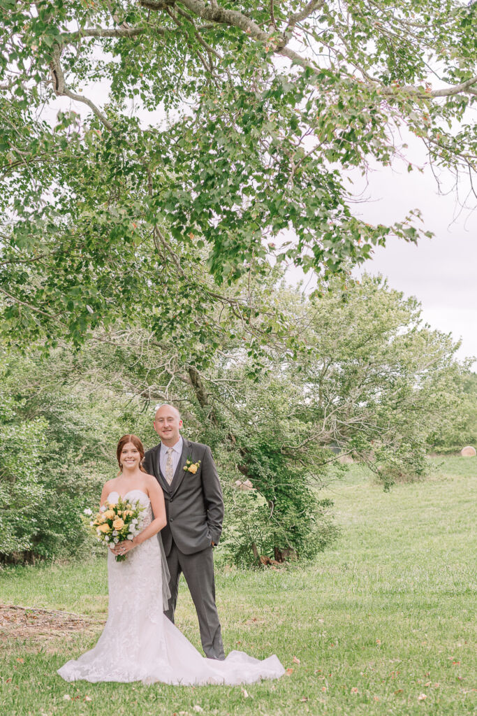 A loving couple enjoying their Winston-Salem wedding in the illuminating countryside at sunset