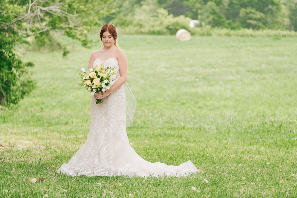 A loving couple enjoying their Winston-Salem wedding in the illuminating countryside at sunset