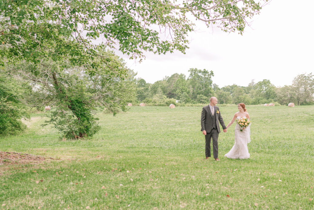 A loving couple enjoying their Winston-Salem wedding in the illuminating countryside at sunset