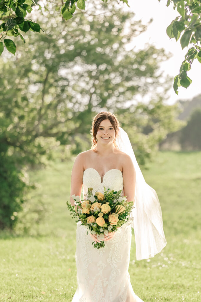 A loving couple enjoying their Winston-Salem wedding in the illuminating countryside at sunset