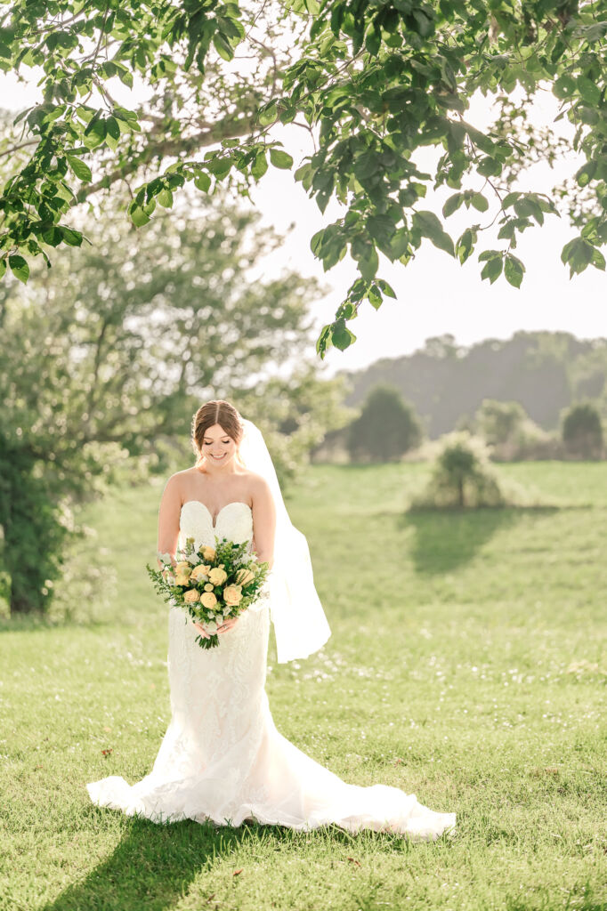 A loving couple enjoying their Winston-Salem wedding in the illuminating countryside at sunset