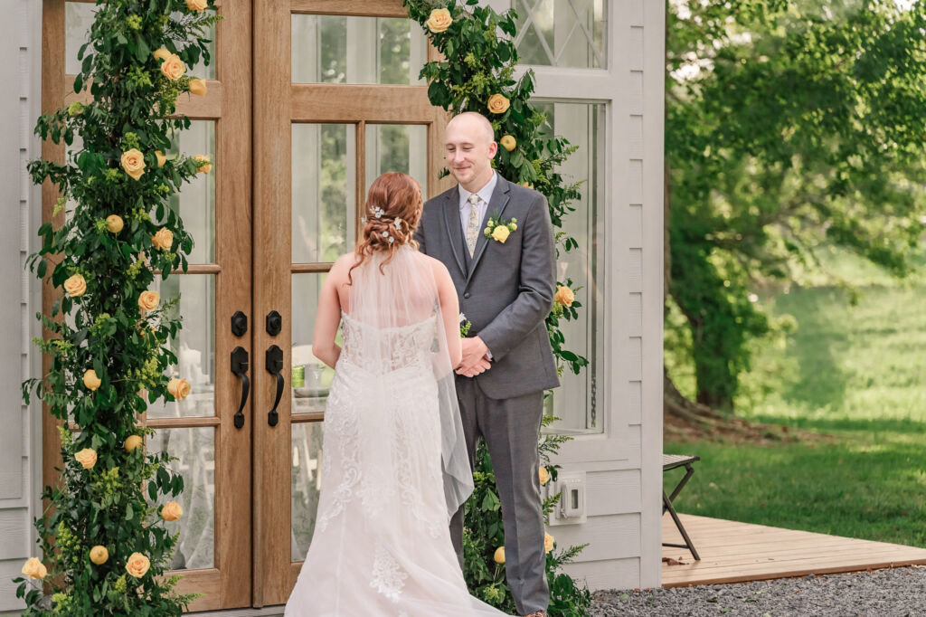 A loving couple enjoying their Winston-Salem wedding in the illuminating countryside at sunset