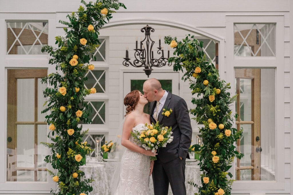 A loving couple enjoying their Winston-Salem wedding in the illuminating countryside at sunset