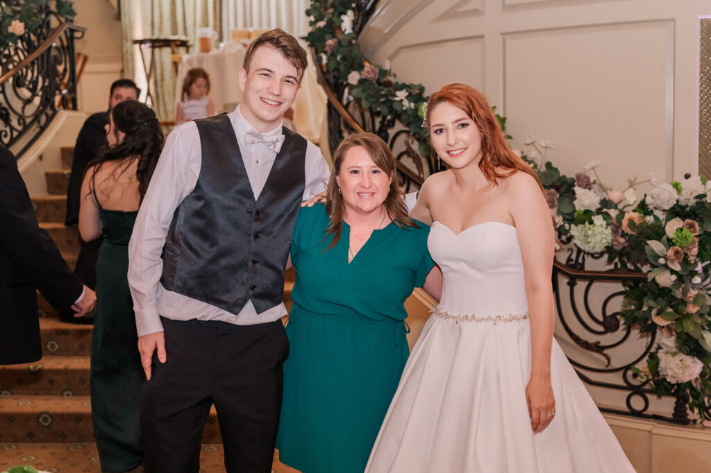 JoLynn Photography, with a happy married she just served, during a Prestonwood country country club wedding reception