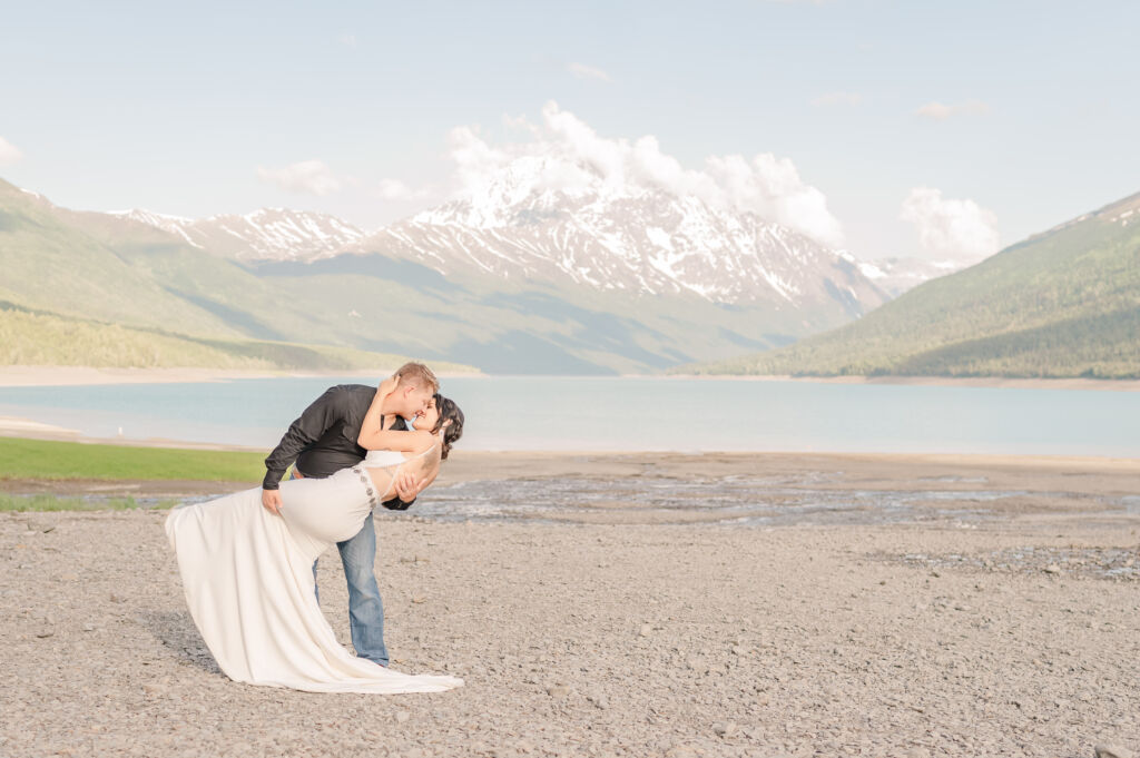 A newly wed couple enjoying their elopement at Lake Eklutna in the summer by Anchorage wedding photographer, JoLynn Photography