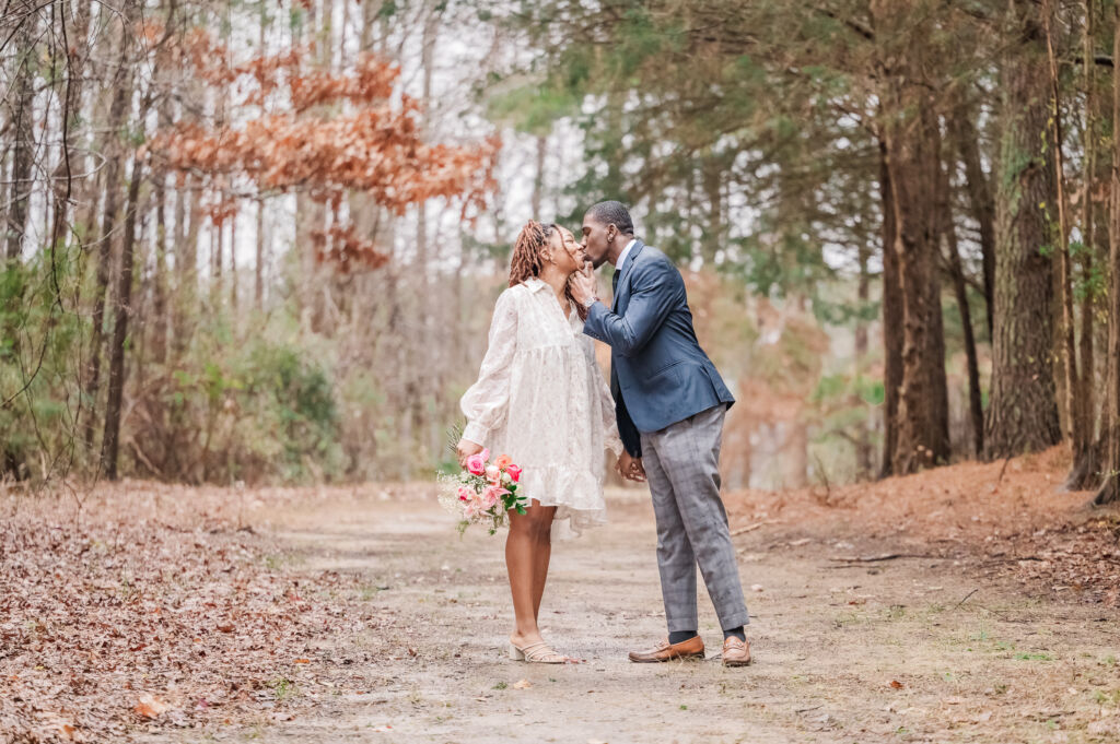 A happy newly engaged couple on New Year's enjoying their Clayton engagement on the Greenway by JoLynn Photography